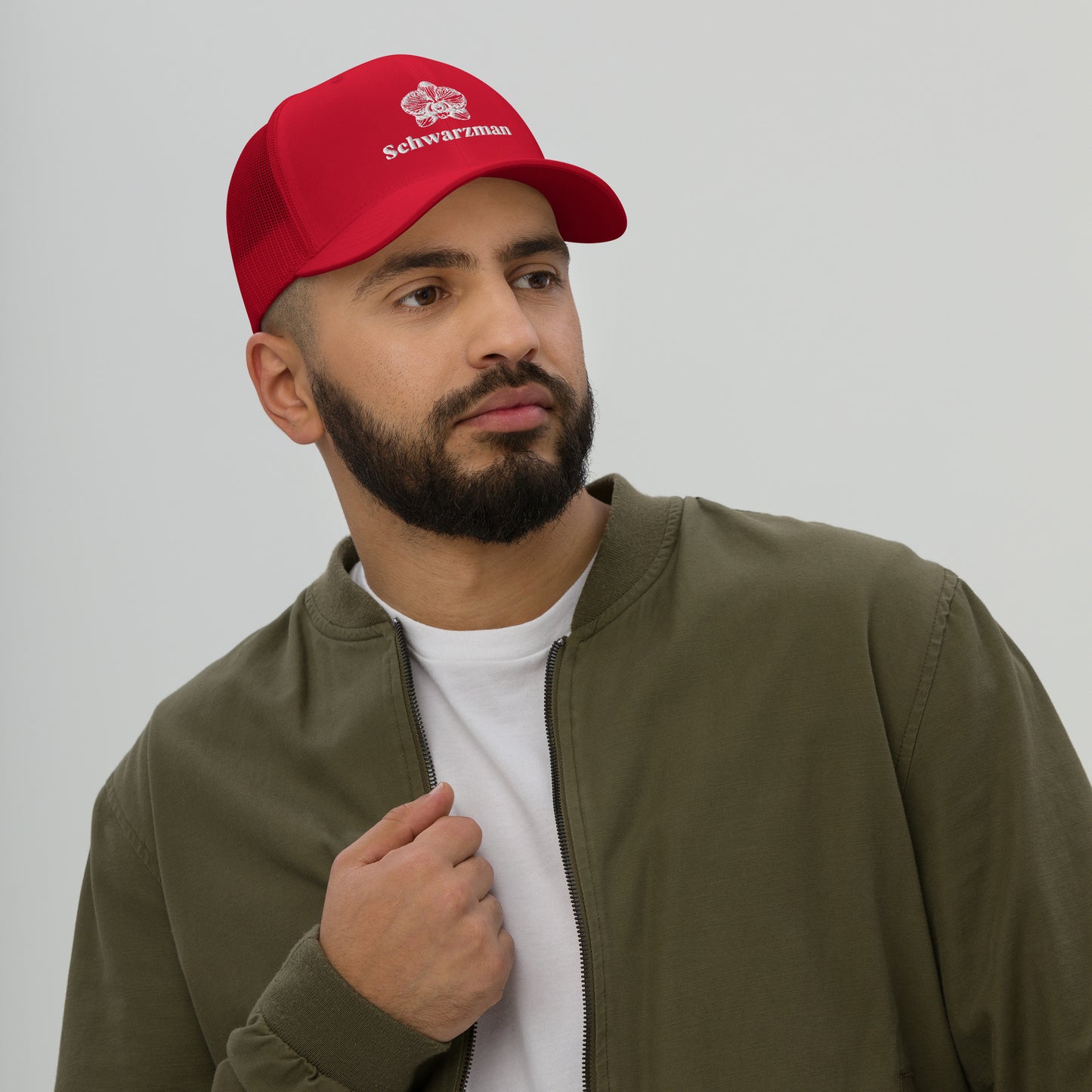 Red retro trucker hat with orchid emblem – Schwarzman