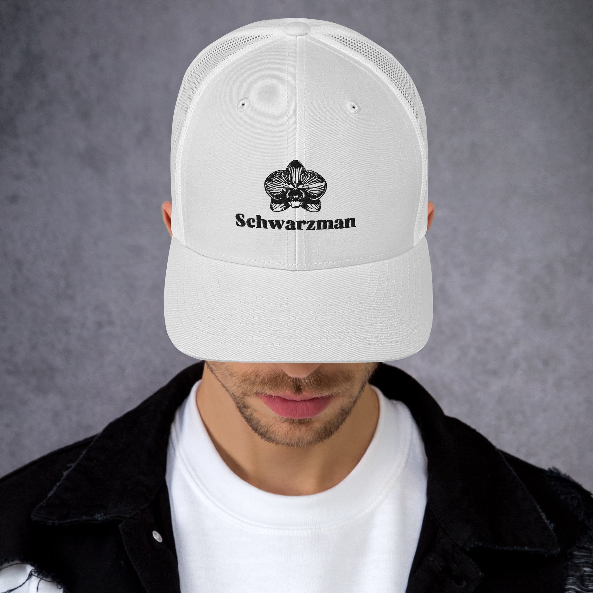 White retro trucker hat with orchid emblem – Schwarzman